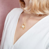 The picture shows a 925 sterling silver, yellow gold vermeil crab pendant.