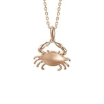 The picture shows a 14K rose gold blue crab pendant.