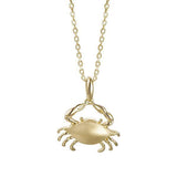 The photo shows a 14K yellow gold blue crab pendant.