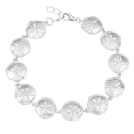 The picture shows a 925 sterling silver white gold-plated sand dollar bracelet with topaz