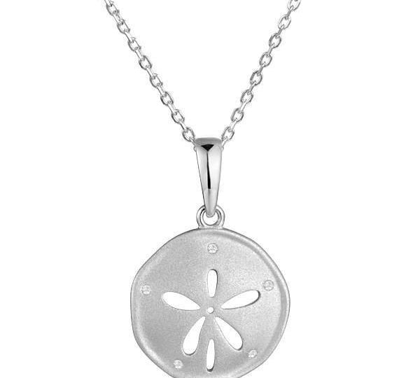 The picture shows a 925 sterling silver, white gold vermeil, sand dollar pendant with topaz.