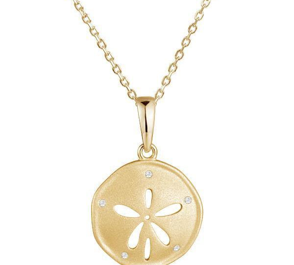 The picture shows a 925 sterling silver, yellow gold vermeil, sand dollar pendant with topaz.