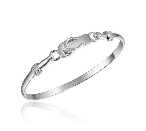 In this photo there is a 925 sterling silver slipper bangle with topaz gemstones.