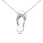 In this photo there is a sterling silver beach slipper pendant with topaz gemstones.