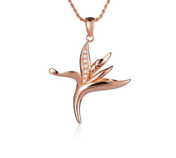 In this photo there is a small rose gold bird of paradise pendant with diamonds.