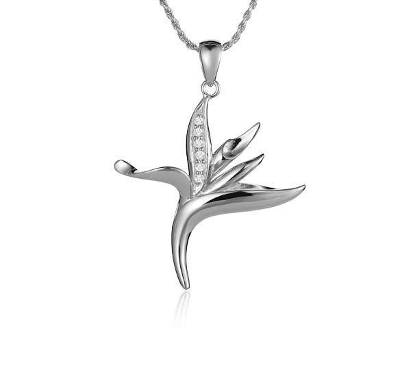 In this photo there is a small white gold bird of paradise pendant with diamonds.