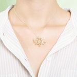 The picture shows a 925 sterling silver yellow gold vermeil coral pendant.