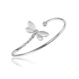 In this photo there is a sterling silver dragonfly bangle with topaz gemstones.