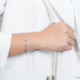 The picture shows a 925 sterling silver fish bone bracelet with cubic zirconia.