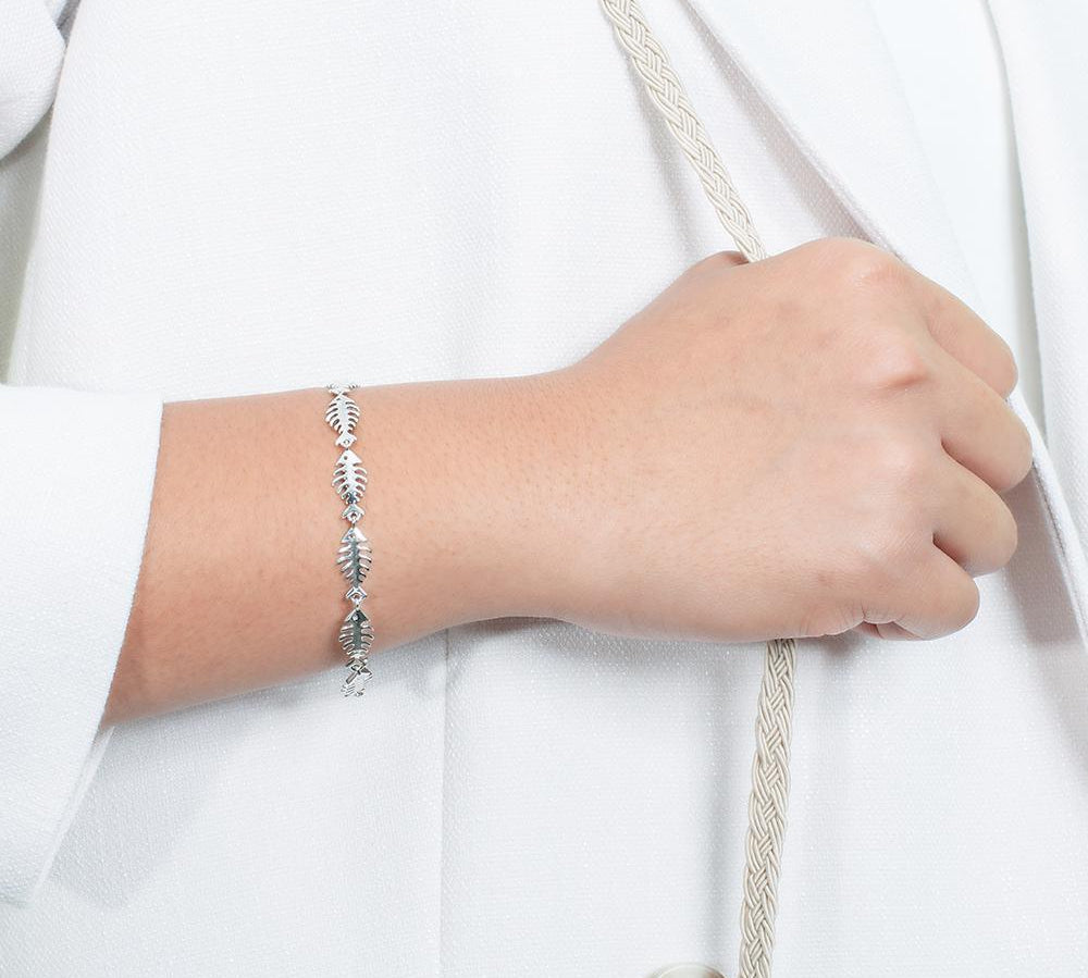 The picture shows a 925 sterling silver fish bone bracelet with cubic zirconia.