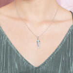 The picture shows a 925 sterling silver fishbone pendant with topaz.
