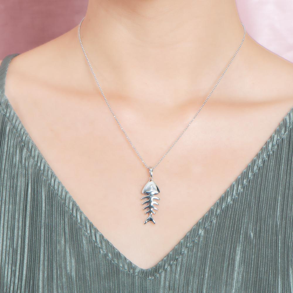 The picture shows a 925 sterling silver fishbone pendant with topaz.