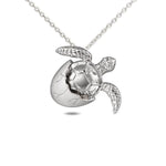 The picture shows a 925 sterling silver sea turtle hatchling pendant.