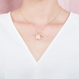 The picture shows a 925 sterling silver, rose gold plated, sea turtle pendant with topaz.