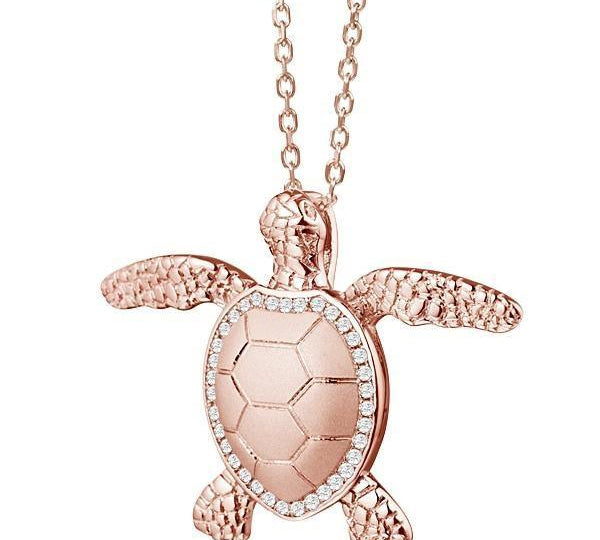 The picture shows a 925 sterling silver, rose gold plated, sea turtle pendant with topaz.