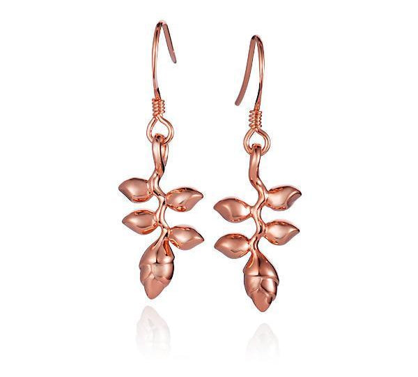 In this photo there is a pair of 14k rose gold heliconia flower hook earrings.