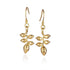 In this photo there is a pair of 14k yellow gold heliconia flower hook earrings.