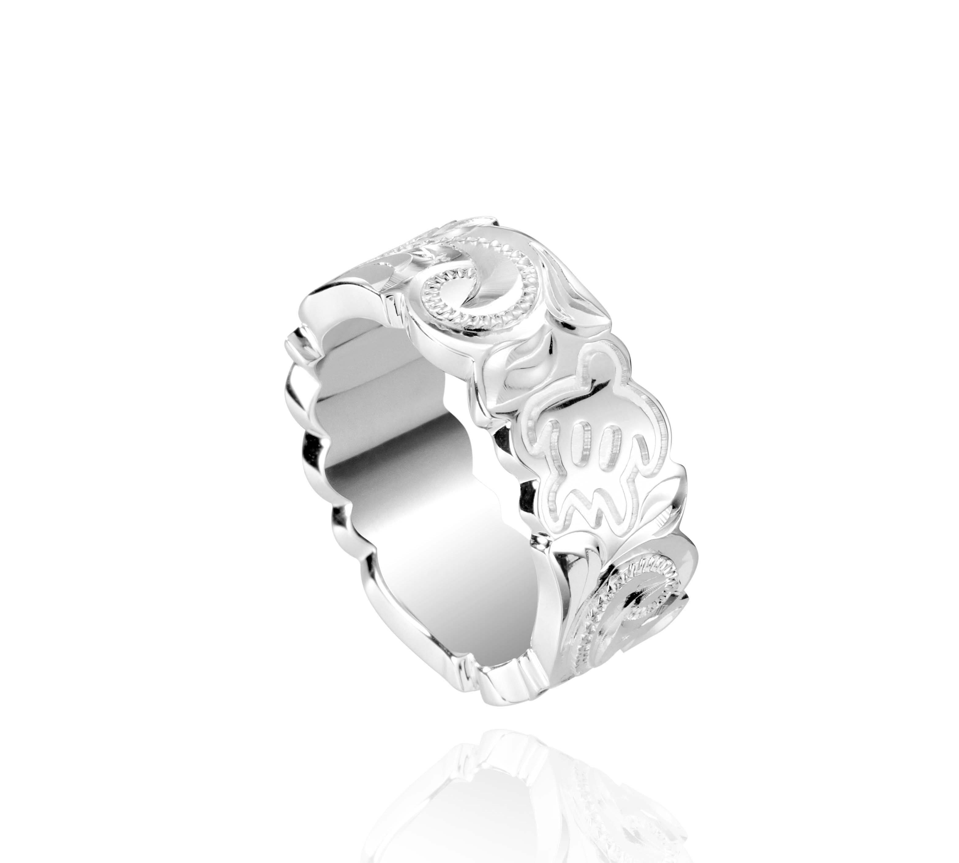 The picture shows a 925 sterling silver 8 mm ring with hand engravings including sea turtles.