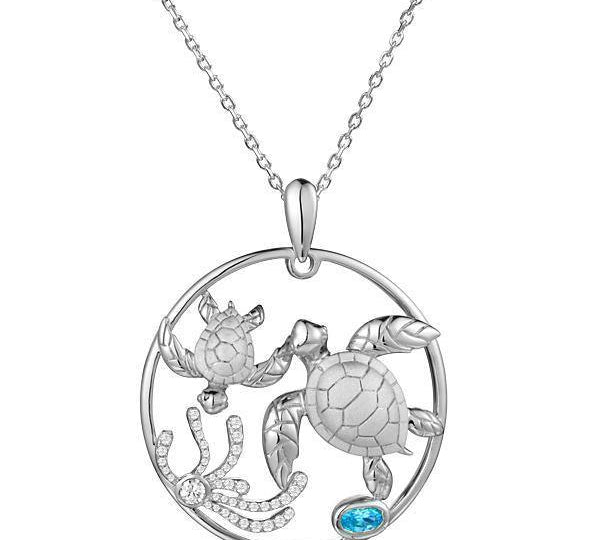 The picture shows a 925 sterling silver, white gold plated, eternity pendant with two sea turtles and seaweed with  aquamarine.