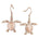 The picture shows a pair of 14K rose gold sea turtle hook earrings with diamonds.