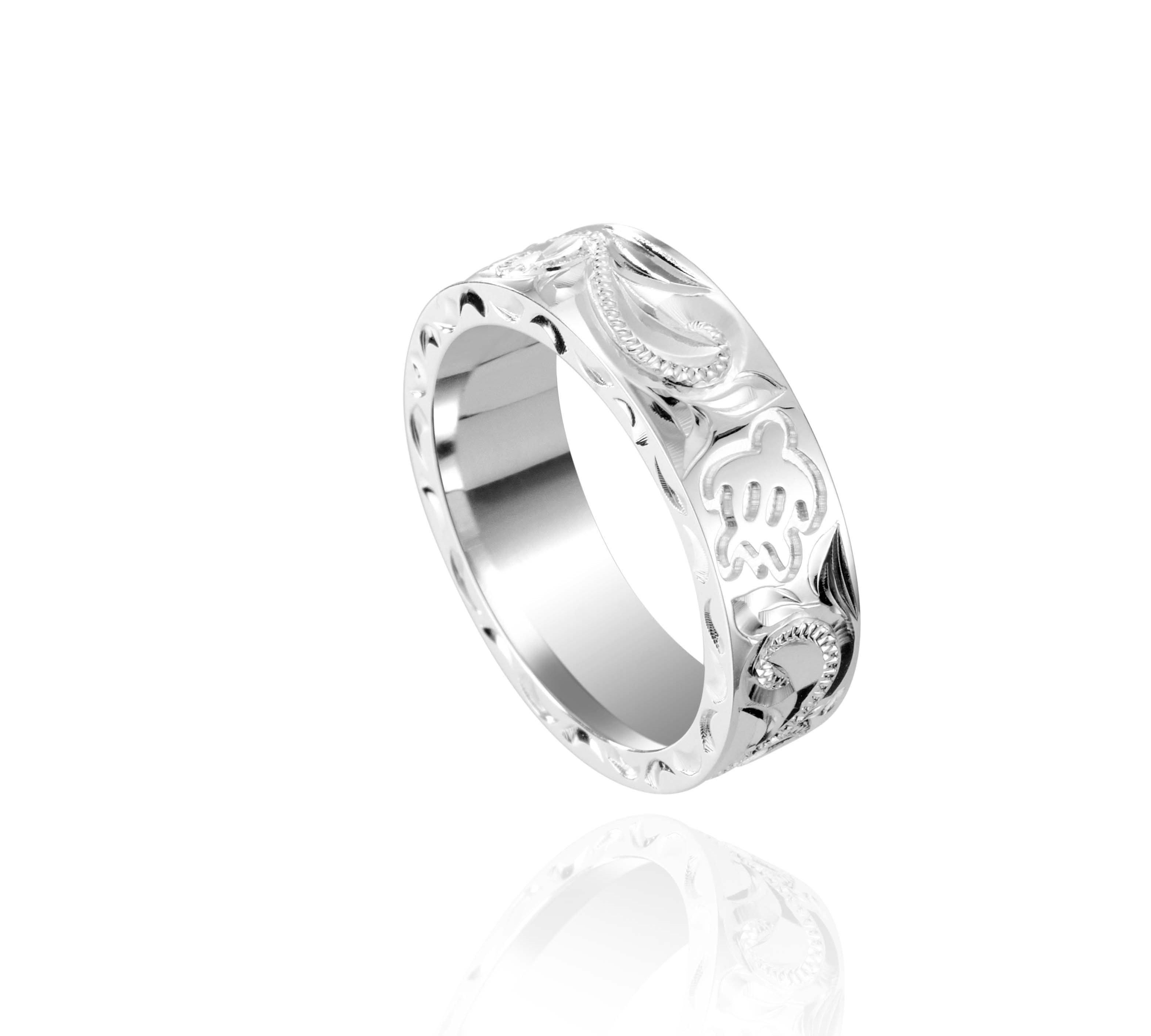 The picture shows a 925 sterling silver 6mm ring with hand engravings including sea turtles.
