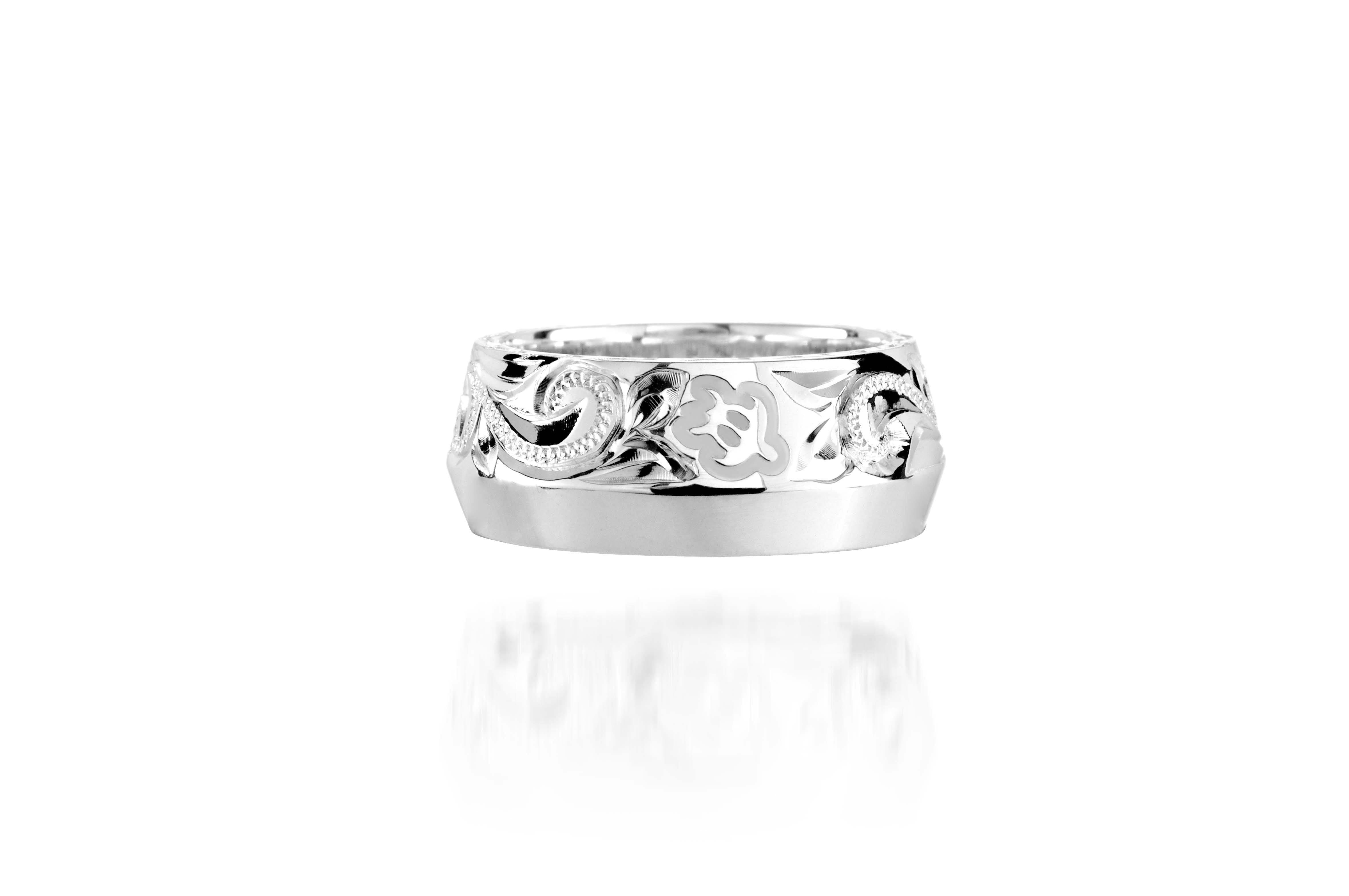 The picture shows a 925 sterling silver 8mm ring with hand engravings including sea turtles.
