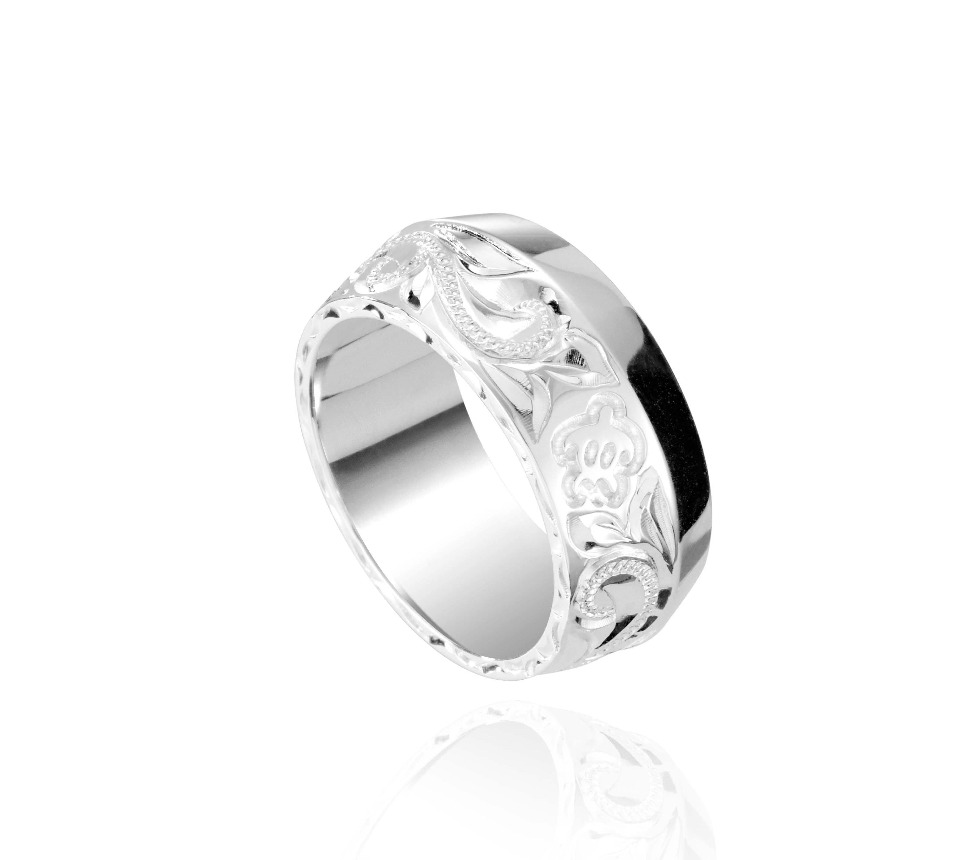 The picture shows a 925 sterling silver 8mm ring with hand engravings including sea turtles.