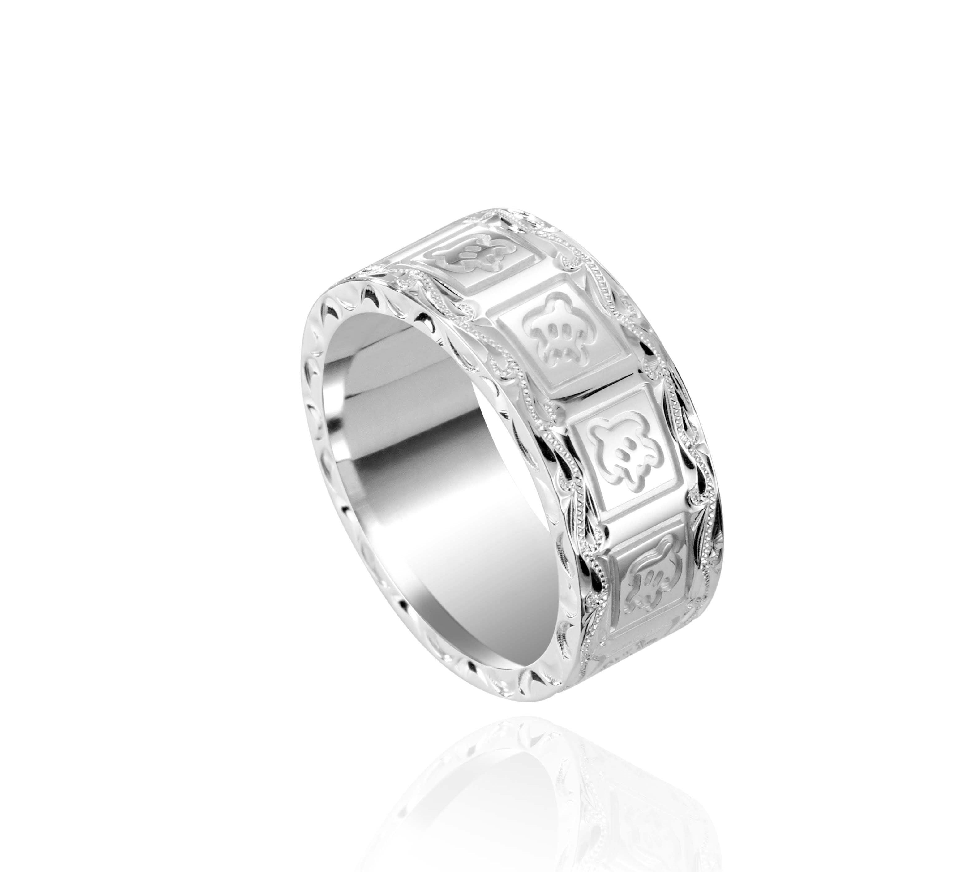The picture shows a 925 sterling silver 8mm ring with hand engravings including sea turtles