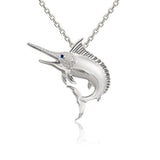 The picture shows a 925 sterling silver marlin pendant with cubic topaz and sapphire.