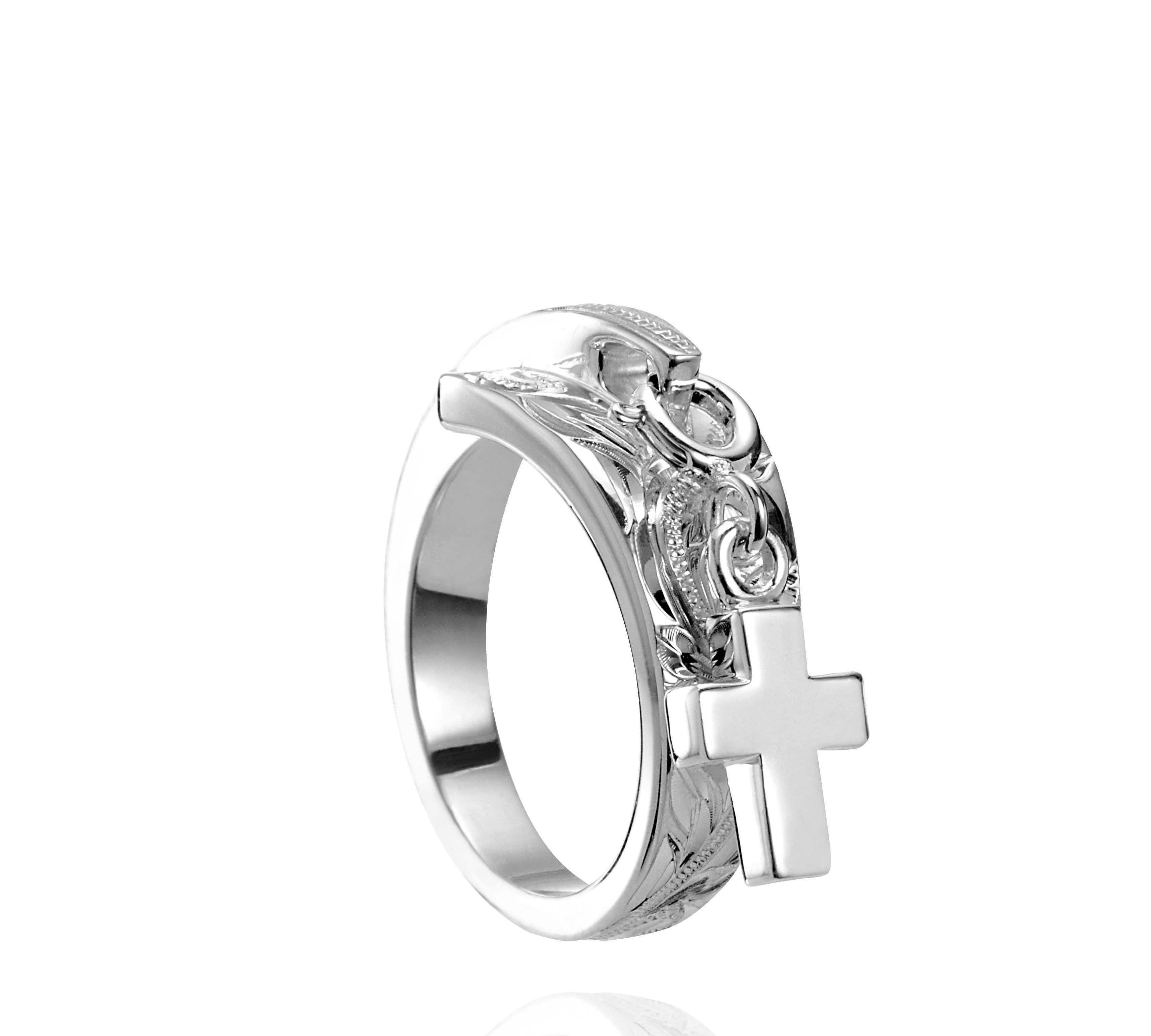 The picture shows a 925 sterling silver cross wrap ring with hand-engravings.