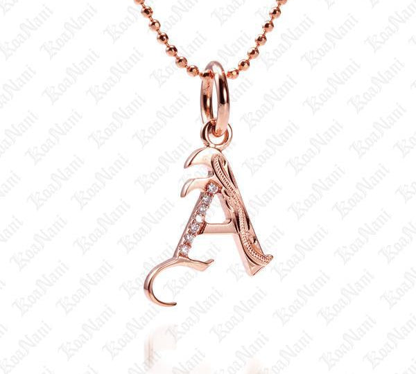 The picture shows a 14K rose gold Koa Nani A initial pendant.
