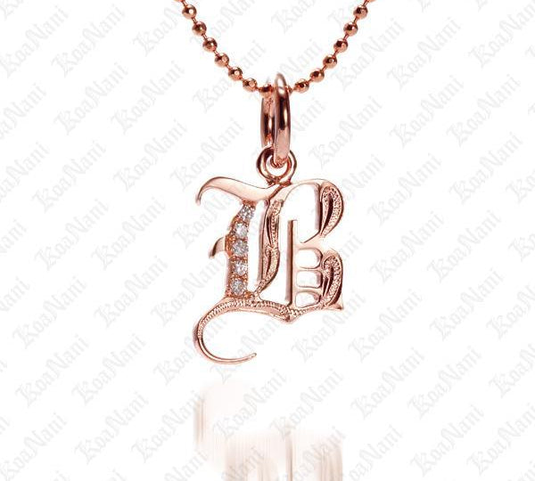 The picture shows a 14K rose gold Koa Nani B initial pendant.