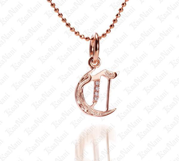 The picture shows a 14K rose gold Koa Nani C initial pendant.