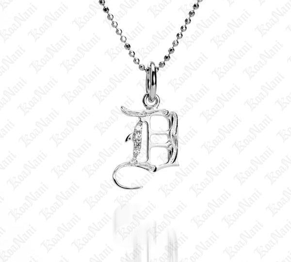 The picture shows a 14K white gold Koa Nani D initial pendant.