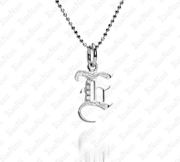 The picture shows a 14K white gold Koa Nani E initial pendant.