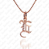 The picture shows a 14K rose gold Koa Nani E initial pendant.