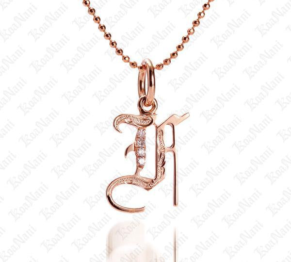 The picture shows a 14K rose gold Koa Nani F initial pendant.