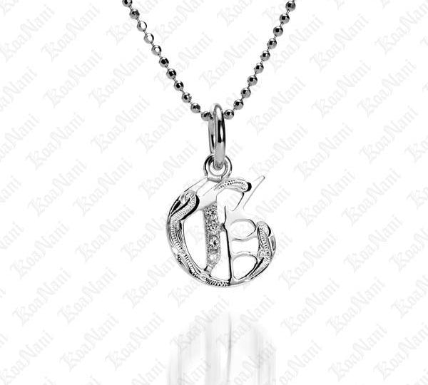 The picture shows a 14K white gold Koa Nani G initial pendant.