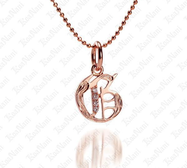 The picture shows a 14K rose gold Koa Nani G initial pendant.