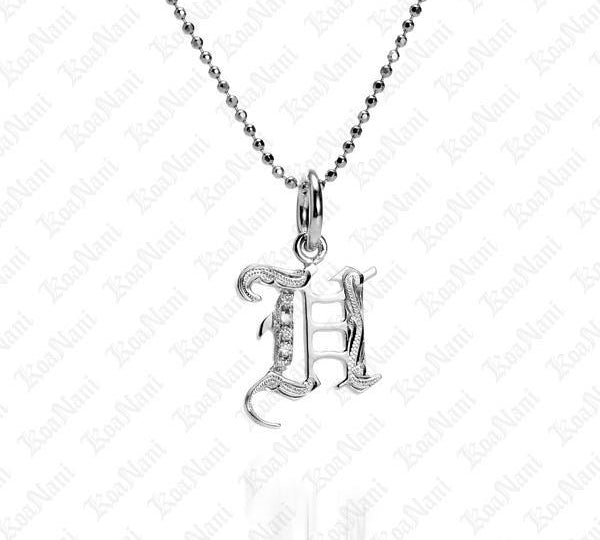 The picture shows a 14K white gold Koa Nani H initial pendant.