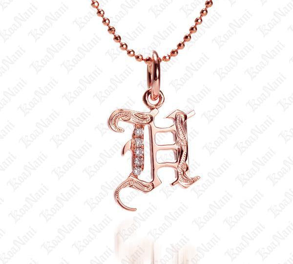 The picture shows a 14K rose gold Koa Nani H initial pendant.