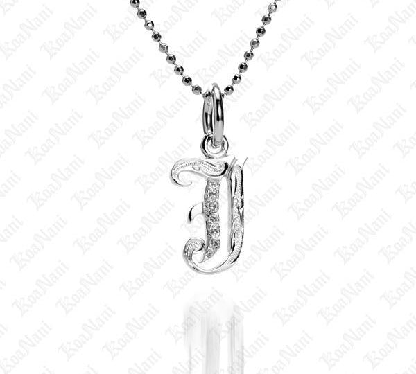 The picture shows a 14K white gold Koa Nani J initial pendant.