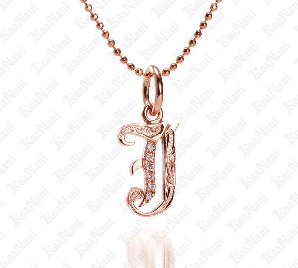 The picture shows a 14K rose gold Koa Nani J initial pendant.
