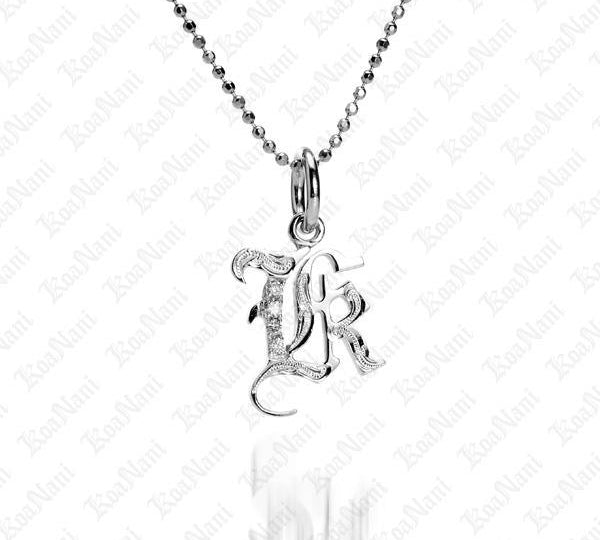 The picture shows a 14K white gold Koa Nani K initial pendant.