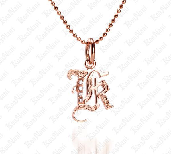 The picture shows a 14K rose gold Koa Nani K initial pendant.