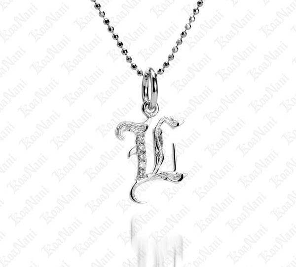 The picture shows a 14K white gold Koa Nani L initial pendant.