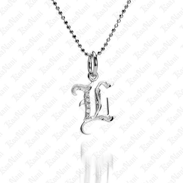 The picture shows a 14K white gold Koa Nani L initial pendant.