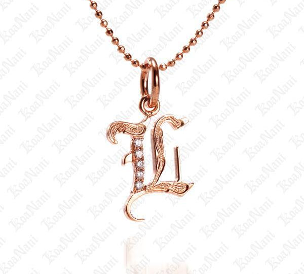 The picture shows a 14K rose gold Koa Nani L initial pendant.