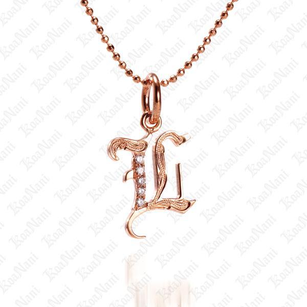 The picture shows a 14K rose gold Koa Nani L initial pendant.