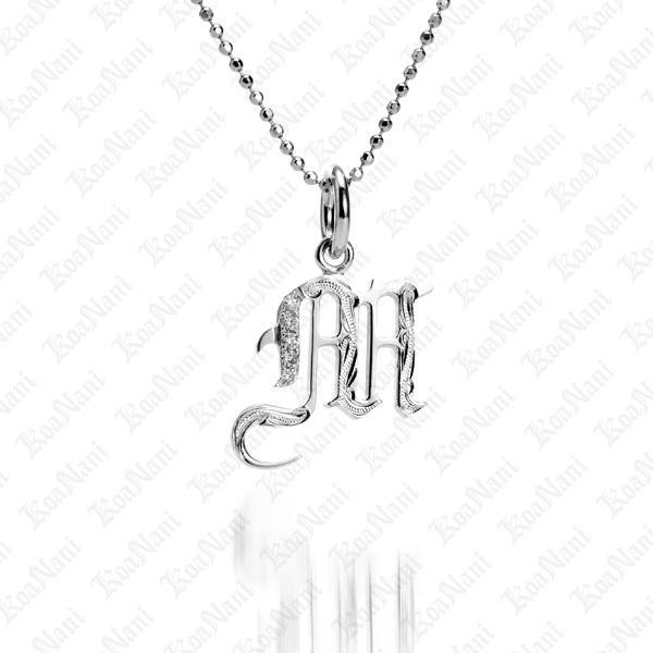 The picture shows a 14K white gold Koa Nani M initial pendant.